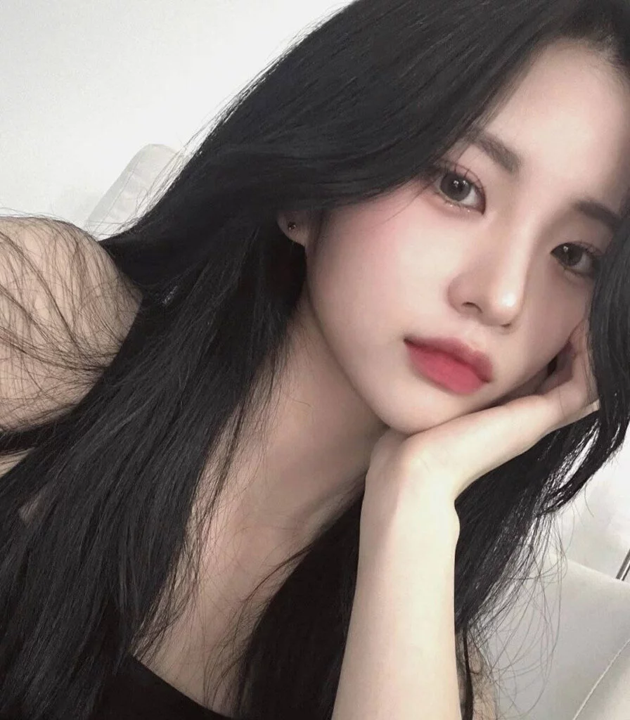 Professional portrait of Jiyoung in soft lighting, wearing neutral-toned attire Professional portrait of Jiyoung in soft lighting, wearing neutral-toned attire