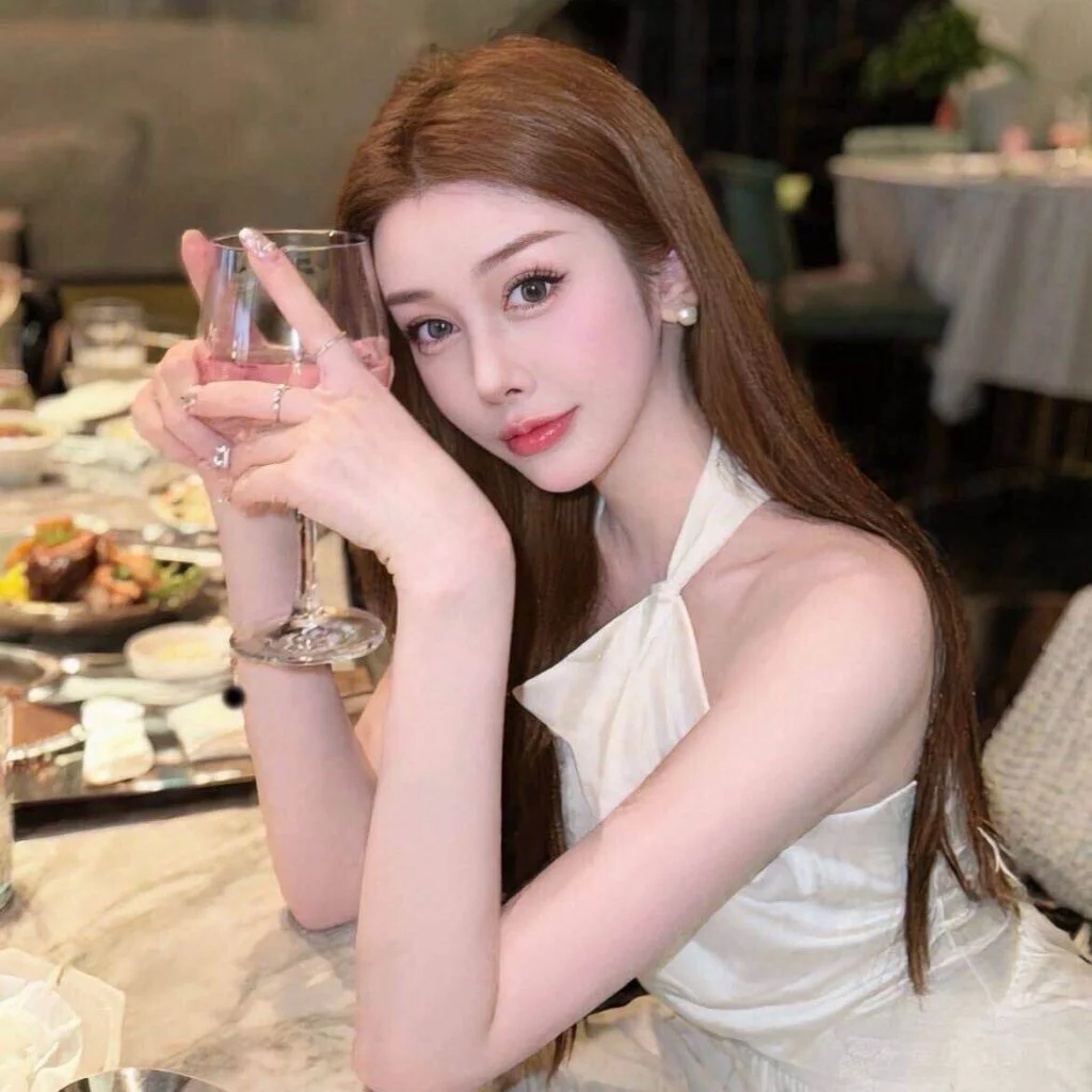 Lanna standing in a modern private room setting in Singapore
